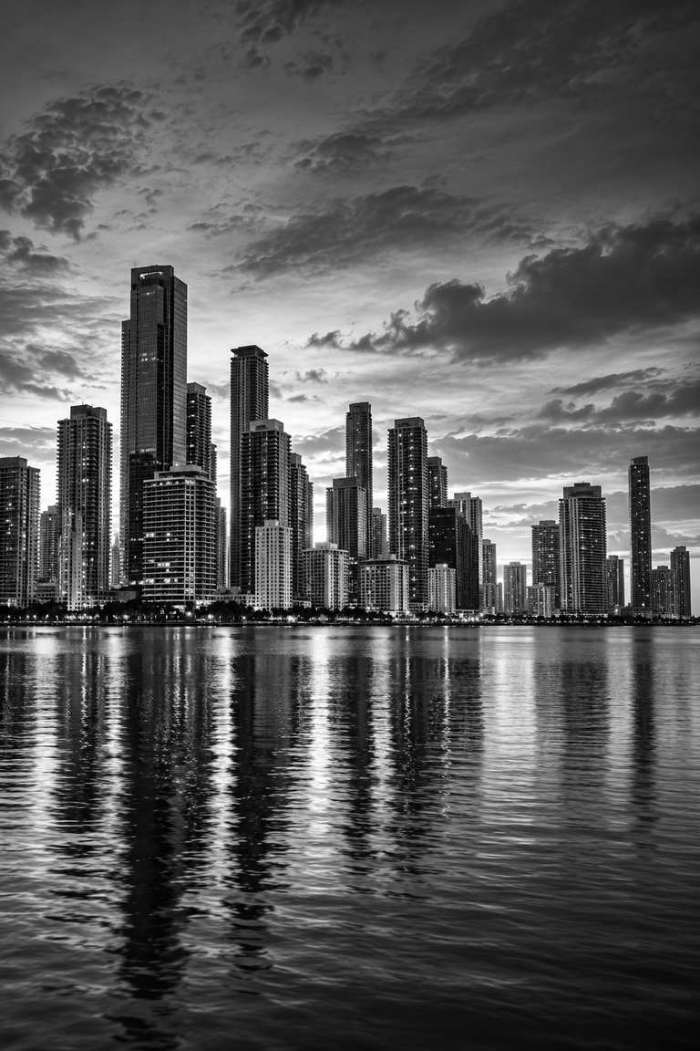 Black and white view of the Miami skyline across Biscayne Bay